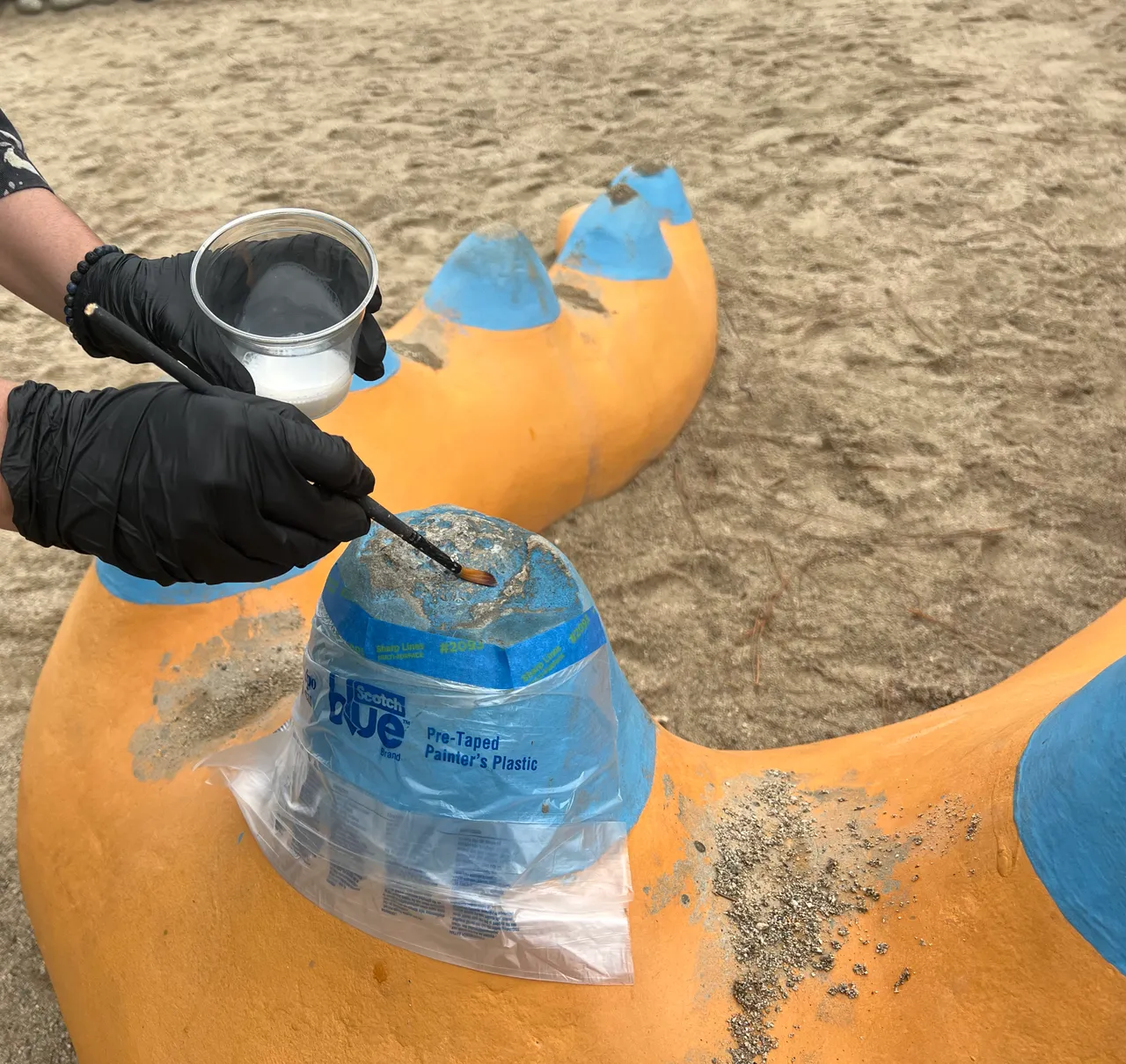 Jennifer working on concrete sculpture elements in Whittier Narrows