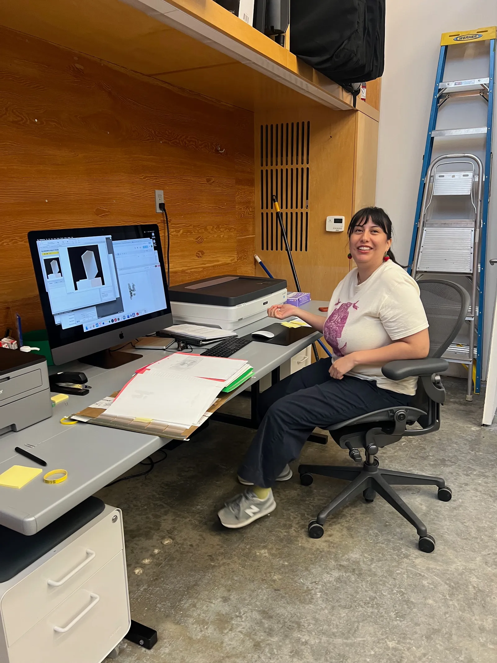 Jennifer reviewing scanned images side-by-side on a large display monitor